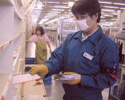 Post office employee works with gloves and mask